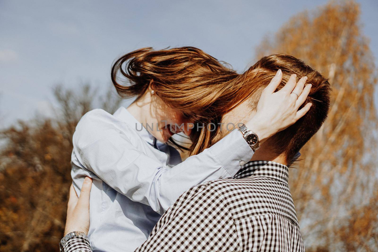 Cute couple having fun in autumn park - selective focus. Love concept