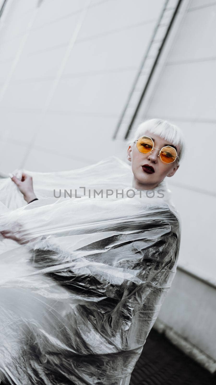 Ecology concept. Girl with plastic wrap. City Style. by natali_brill