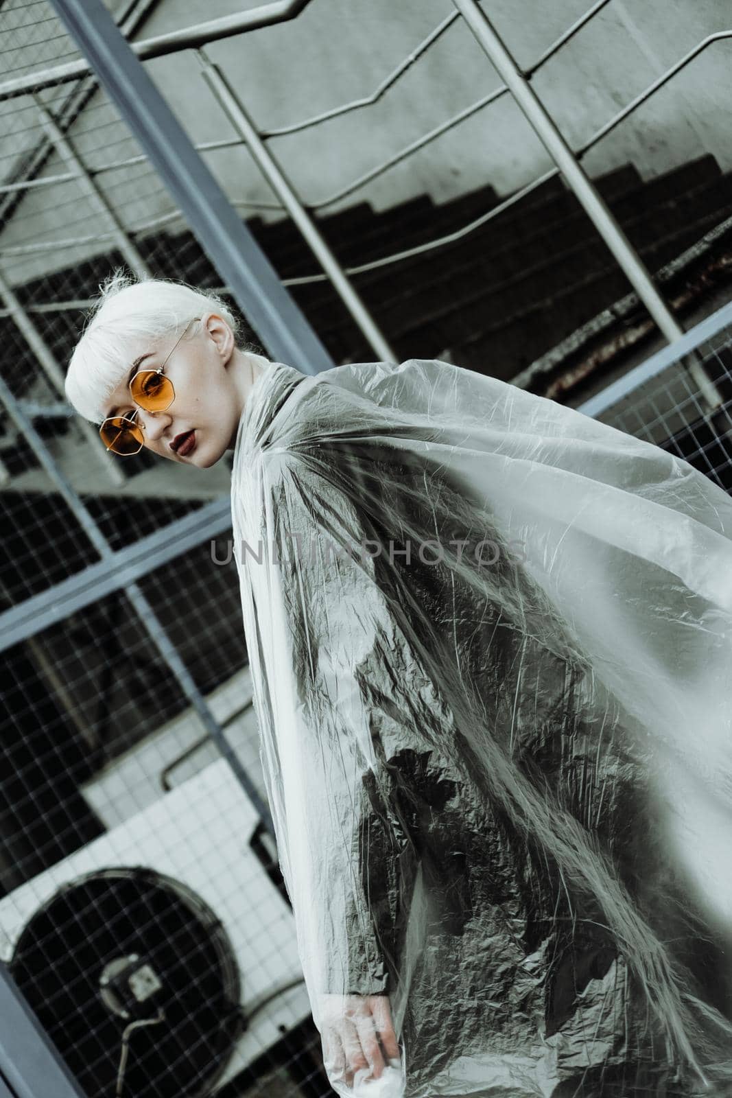 Ecology concept. Girl with plastic wrap. City Style. Urban photo