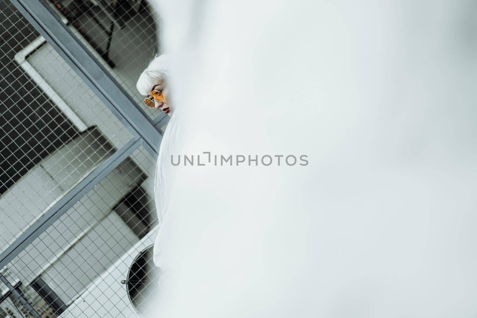 Ecology concept. Girl with plastic wrap. City Style. Urban photo