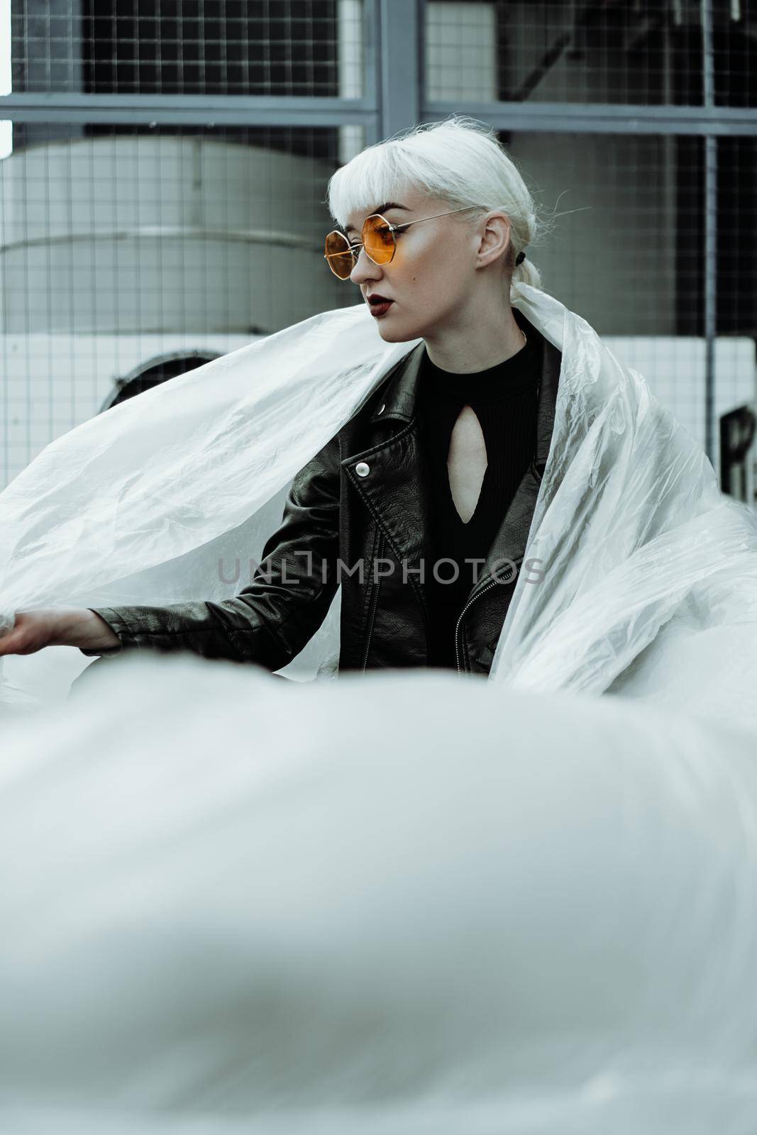 Ecology concept. Girl with plastic wrap. City Style. by natali_brill