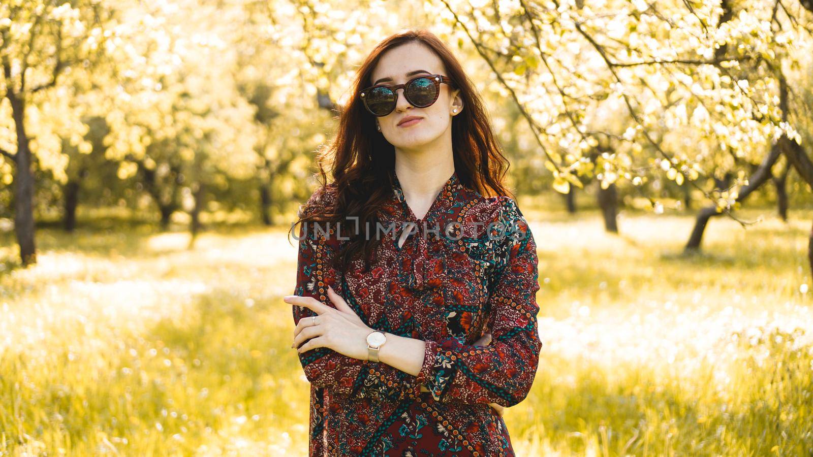 Smiling summer woman with sunglasses. Beautiful Young Woman Outdoor. Enjoy Nature. Healthy Smiling Girl in the Spring Park. Sunny day