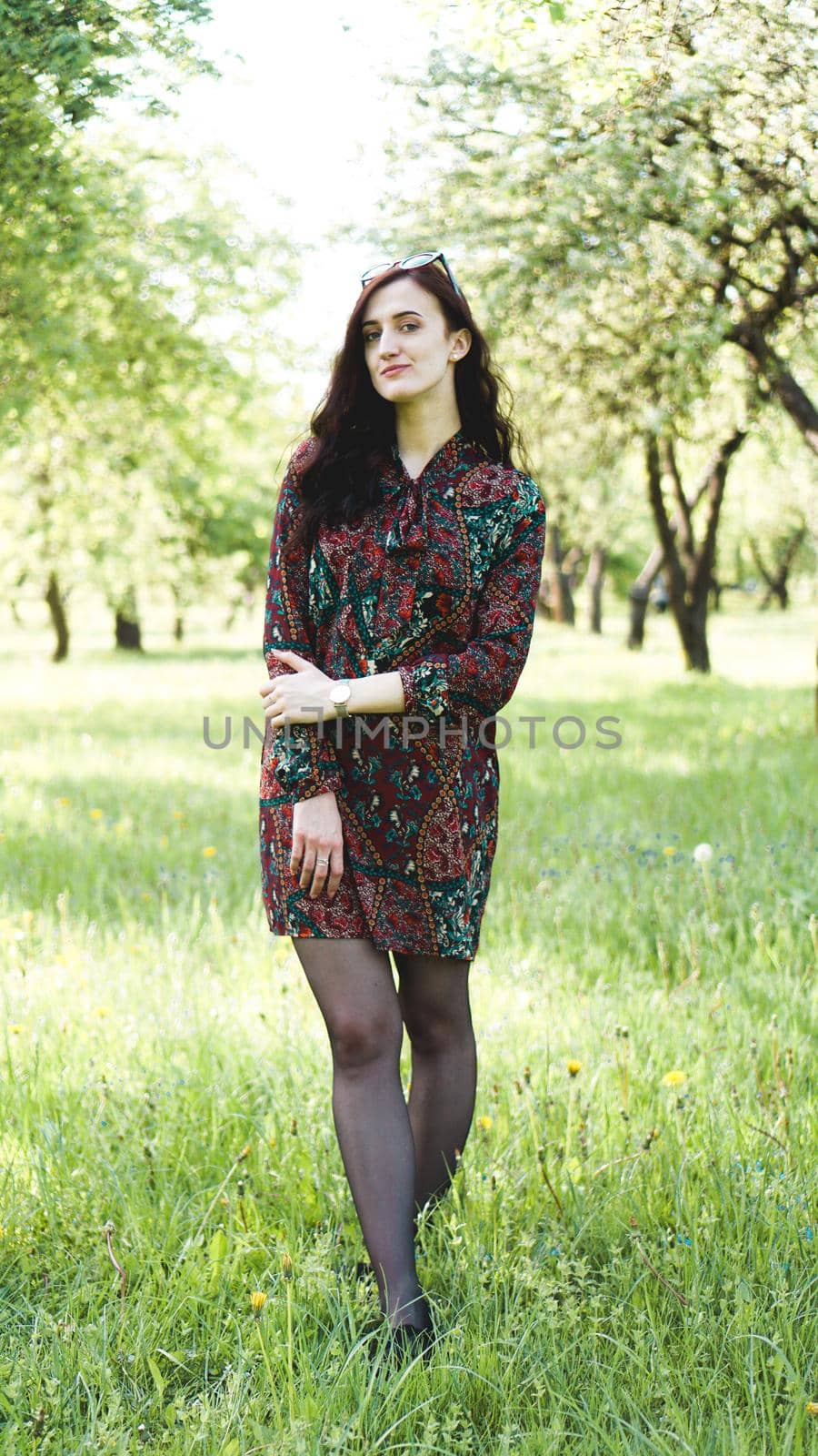 Beautiful Young Woman Outdoor. Enjoy Nature. Healthy Smiling Girl in the Spring Park. Sunny day