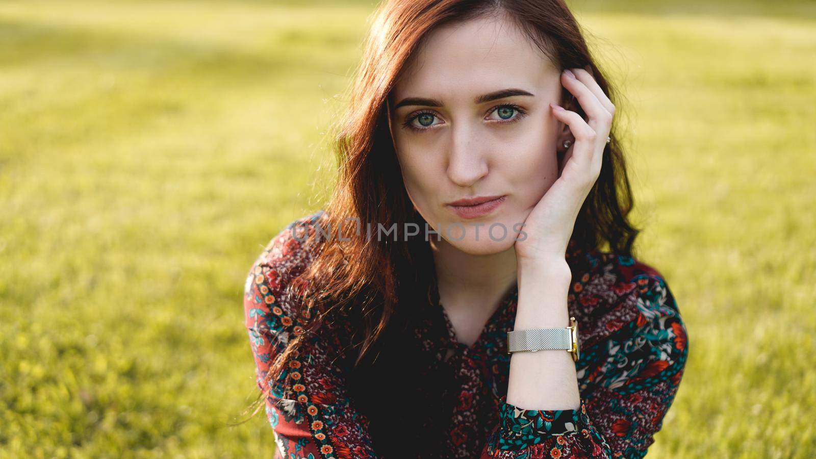 Attractive young woman enjoying her time outside in park - summer time