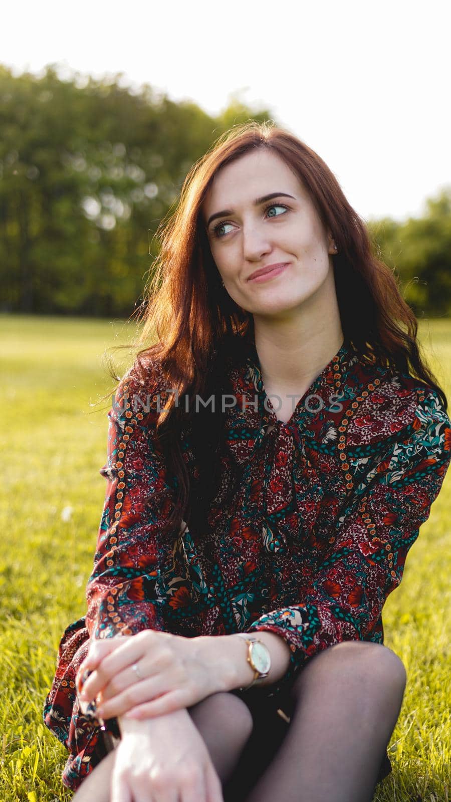 Attractive young woman enjoying her time outside in park - summer time