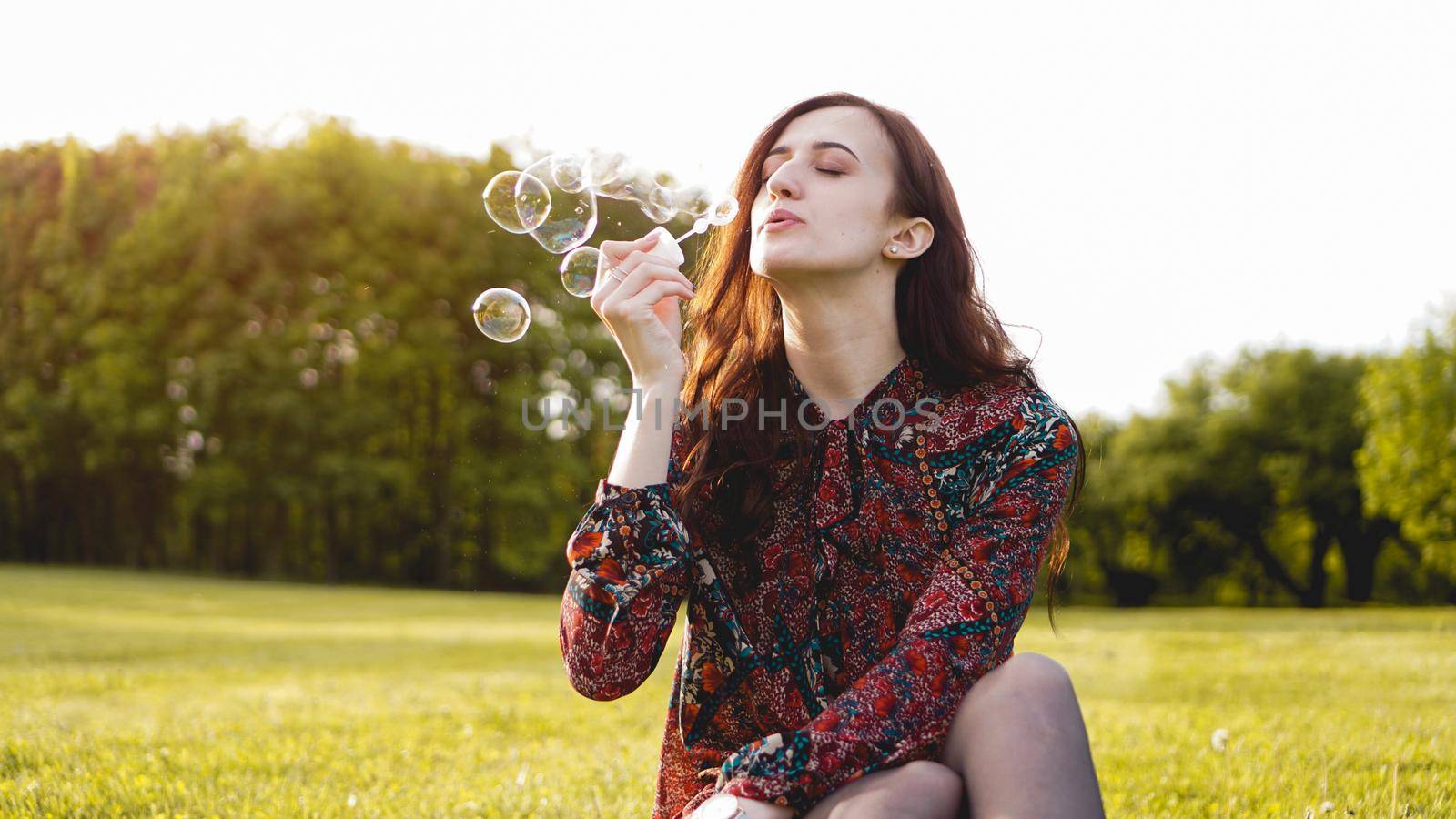 Romantic portrait of young woman with soap balloons. by natali_brill