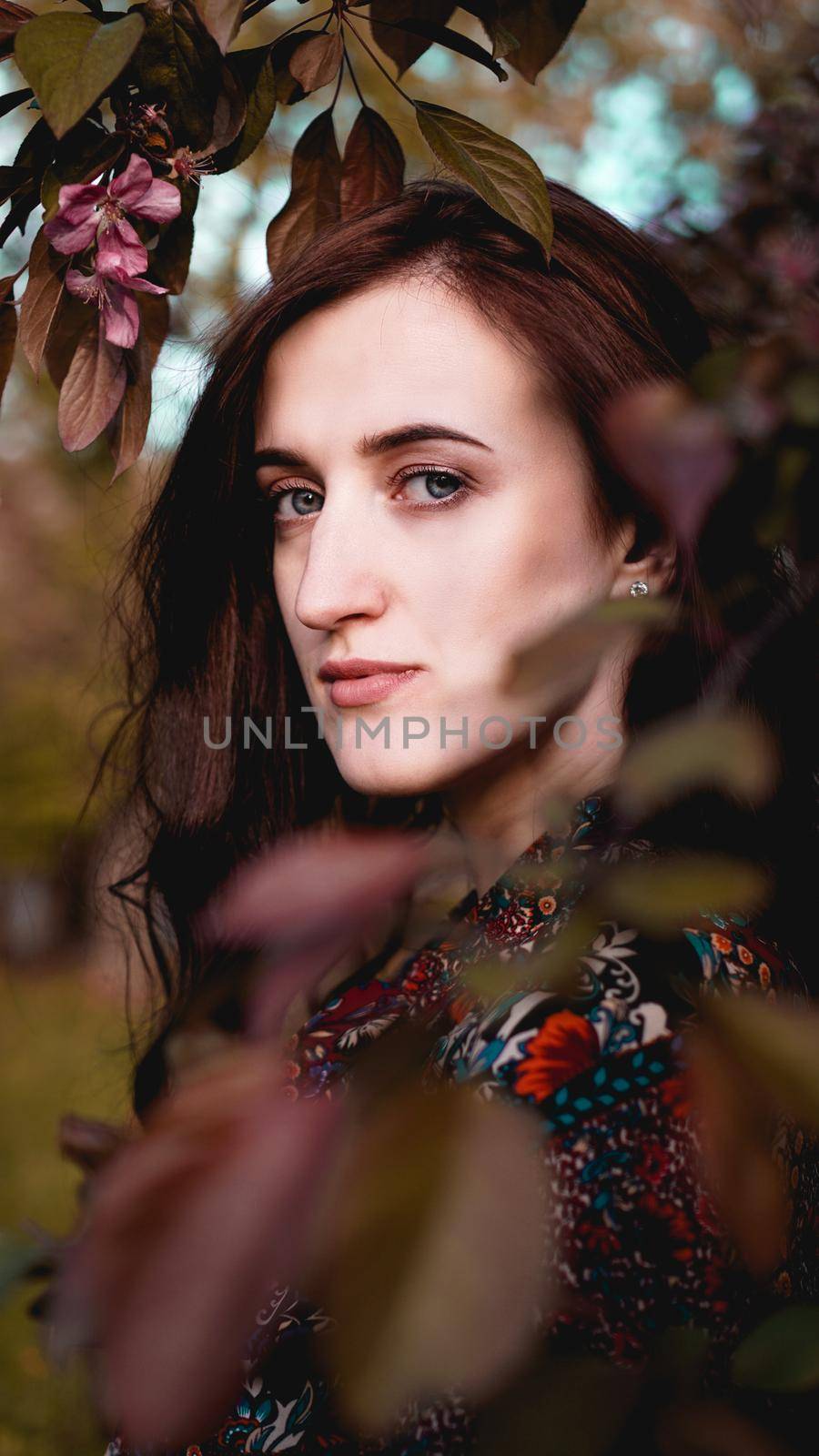 Beautiful young woman in burgundy leaves by natali_brill