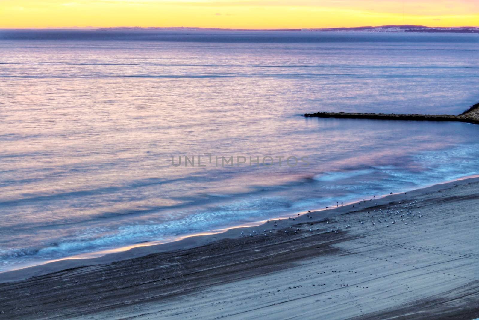 Spectacular and colorful sunset in the bay of Santa Pola, Alicante, Spain in autumn