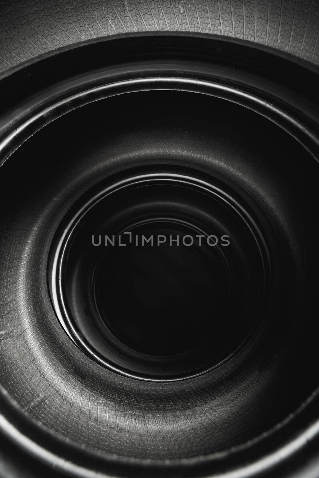 inside of stacked car tires, abstract black background by nikkytok