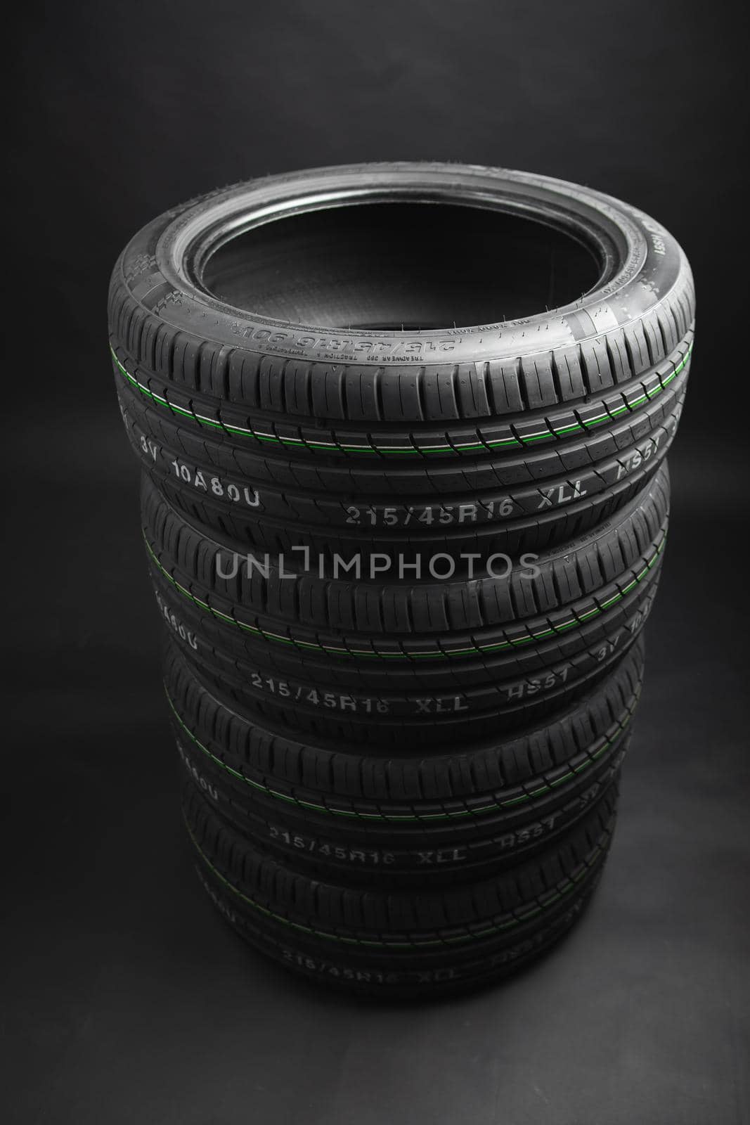 stack of summer tires, gray background
