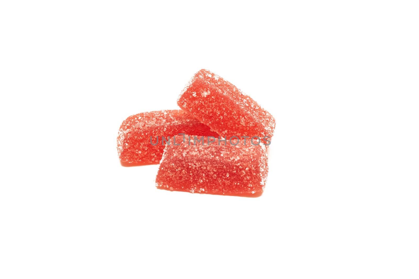 Three marmalade candies close up, isolated on white background