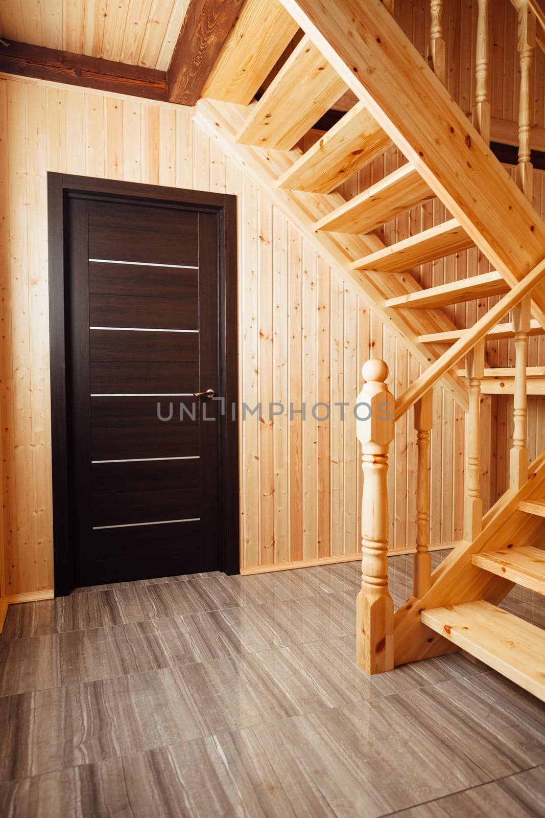 staircase and door inside of wooden house