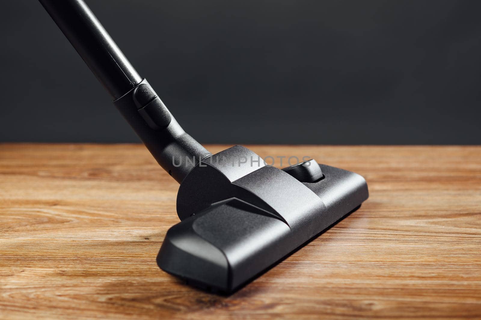 vacuum cleaner brush on wooden floor