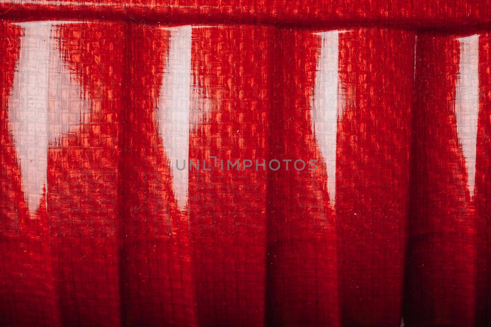 red shell carbon fiber background, closeup view