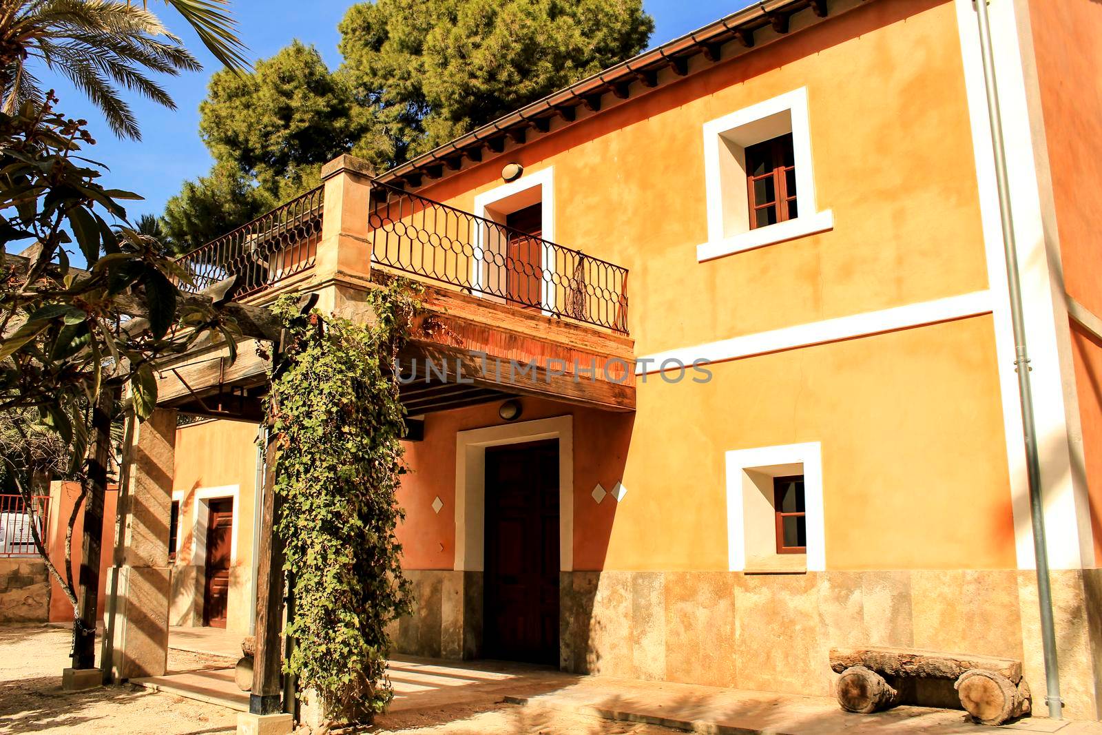 Elche, Spain- 14 February, 2018: Typical and colorful house in a palm orchard in Elche, Spain on a sunny day. Huerto de San Placido.