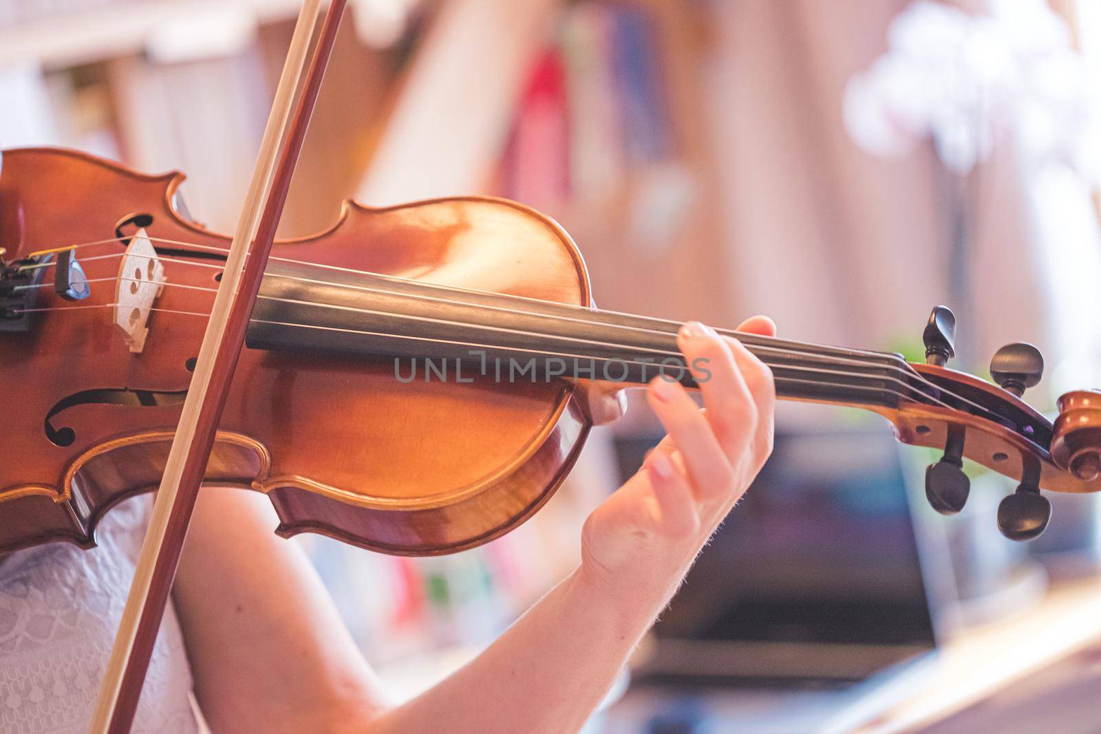Young girl practices on her violin, acoustic music