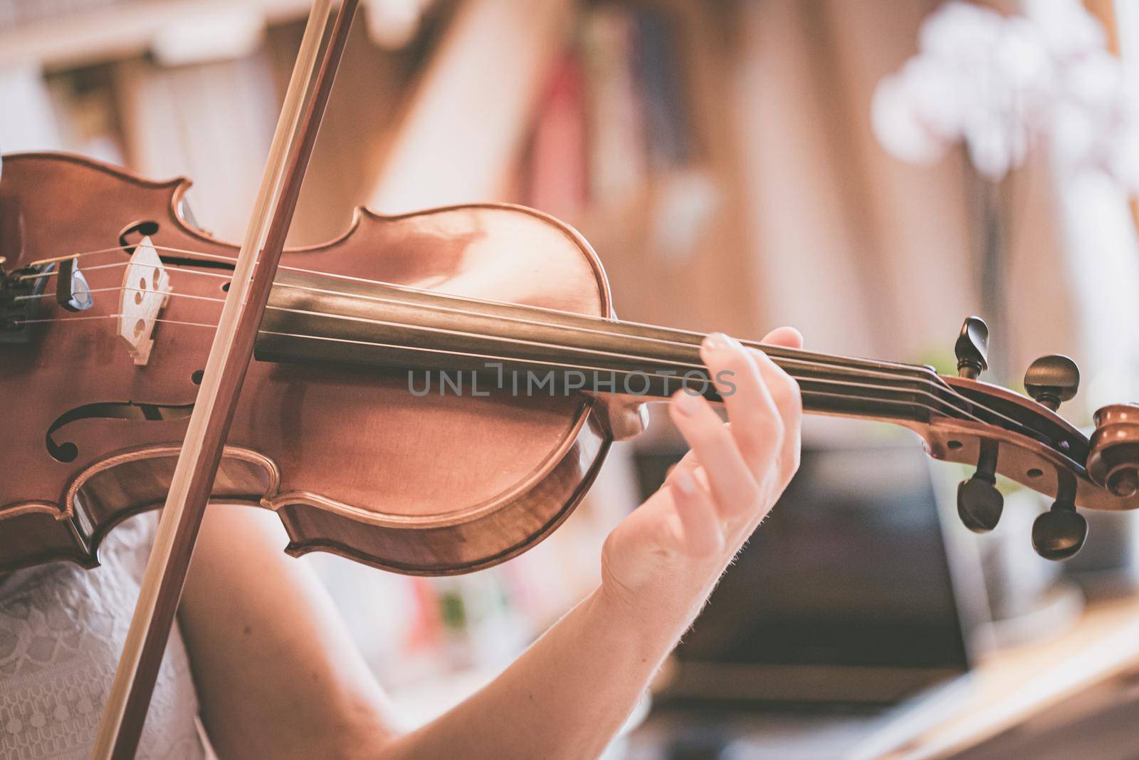 Young girl practices on her violin, acoustic music