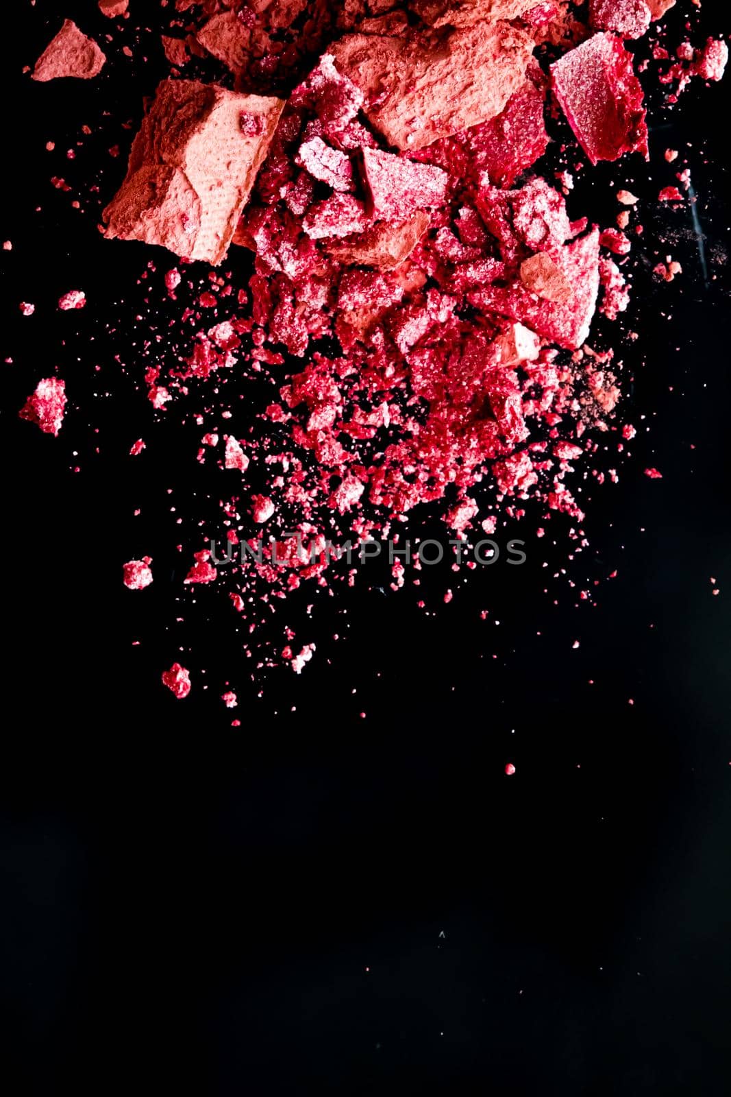 Crushed cosmetics, mineral organic eyeshadow, blush and cosmetic powder isolated on black background, makeup and beauty banner, flatlay design.