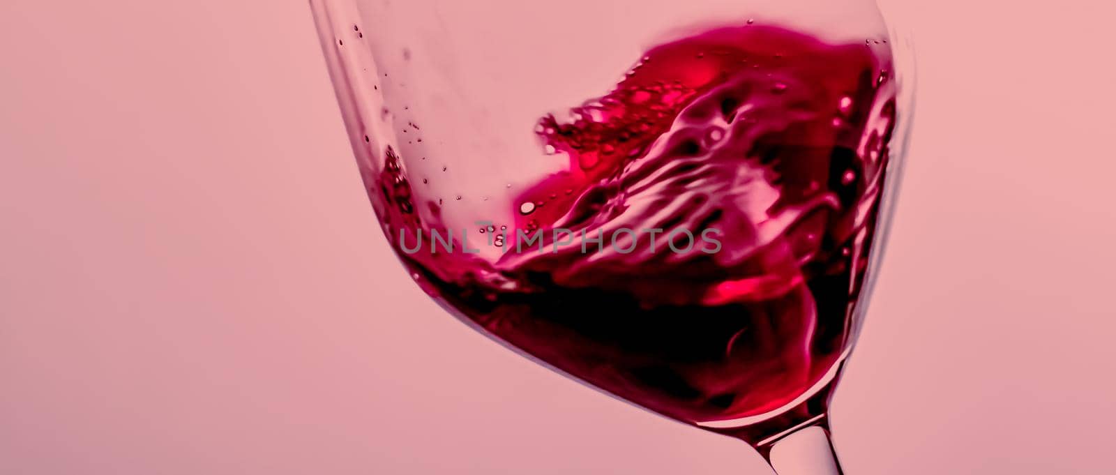 Red wine in crystal glass, alcohol drink and luxury aperitif, oenology and viticulture product.