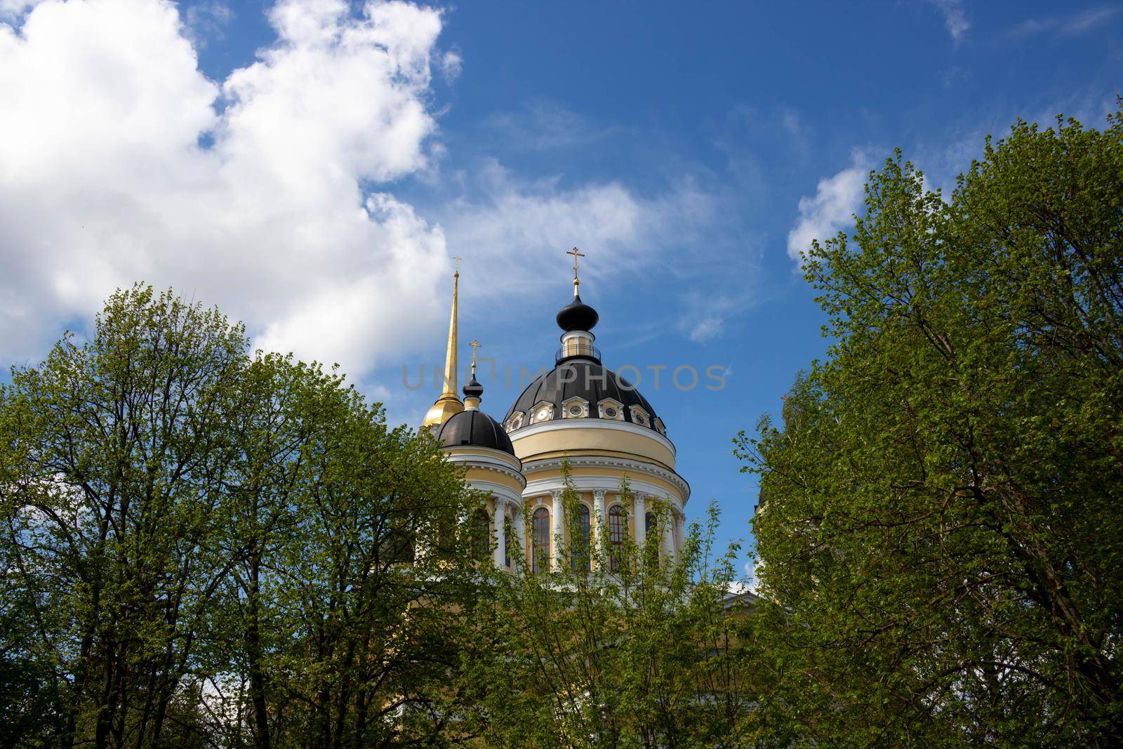 Domes with crosses of the Orthodox church on the background of a blue sky with white clouds. Christian Church, a concept of faith.