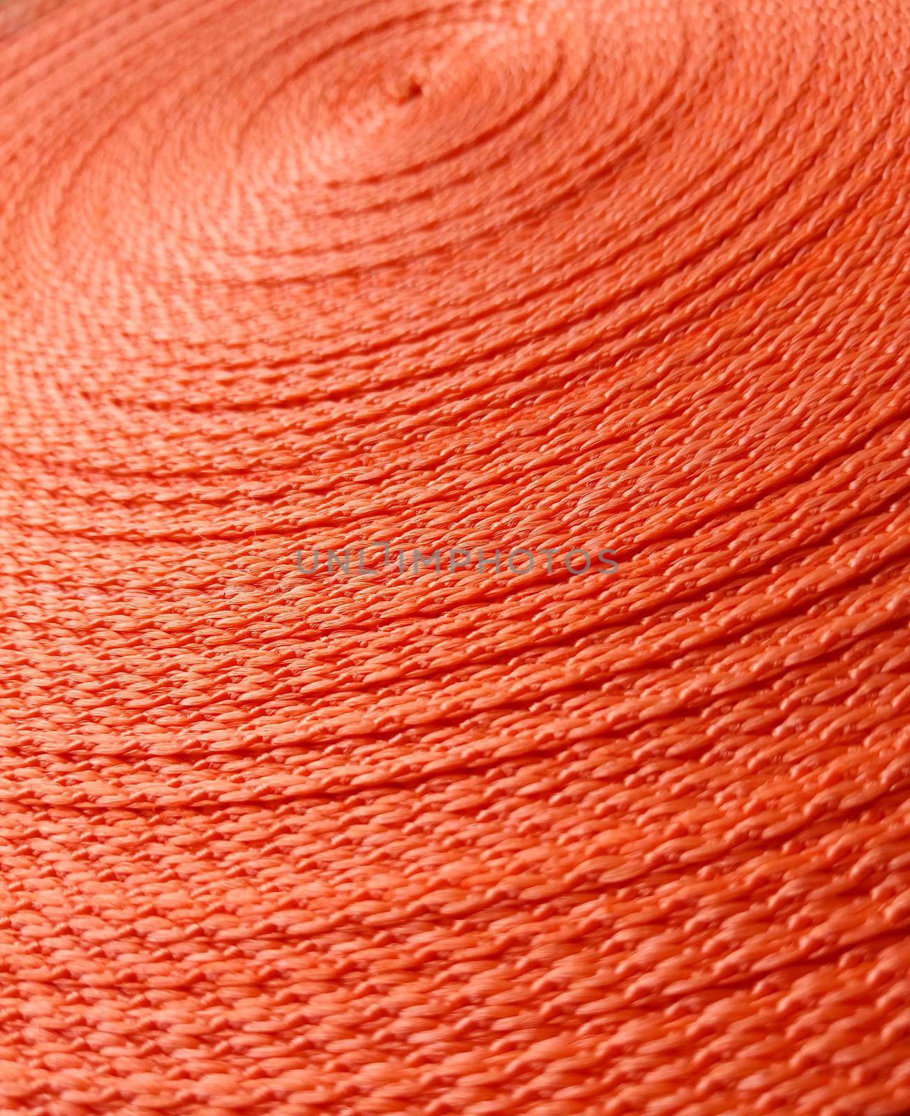 Orange abstract background. Circular pattern of orange sling by lapushka62