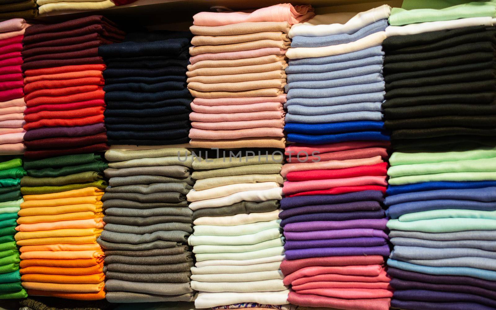 Pile of bright Multi-colored pieces of fabric in a bazaar