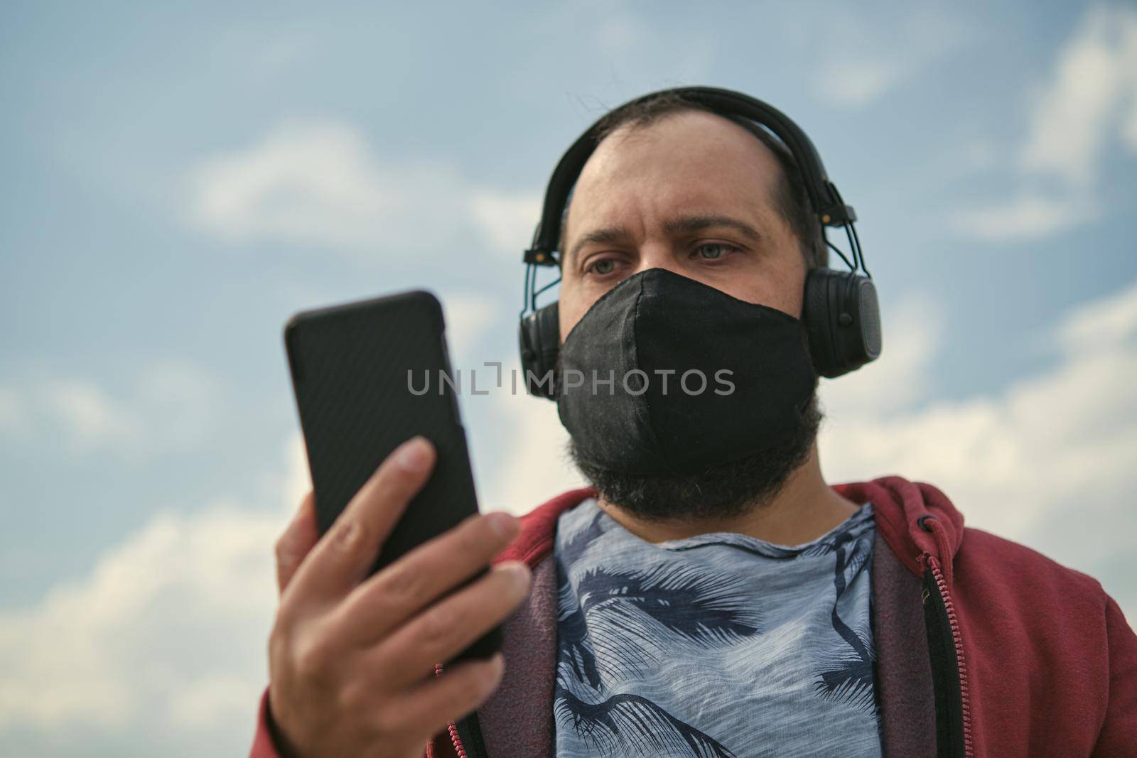 Middle aged man listening to music, close up by snep_photo