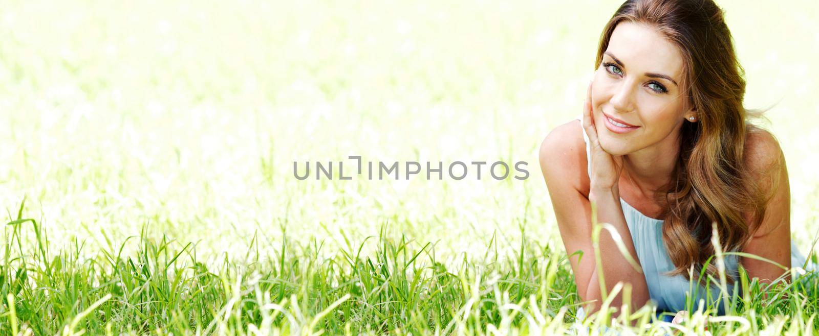 Portrait of attractive blue eyes girl smiling in spring park nature background