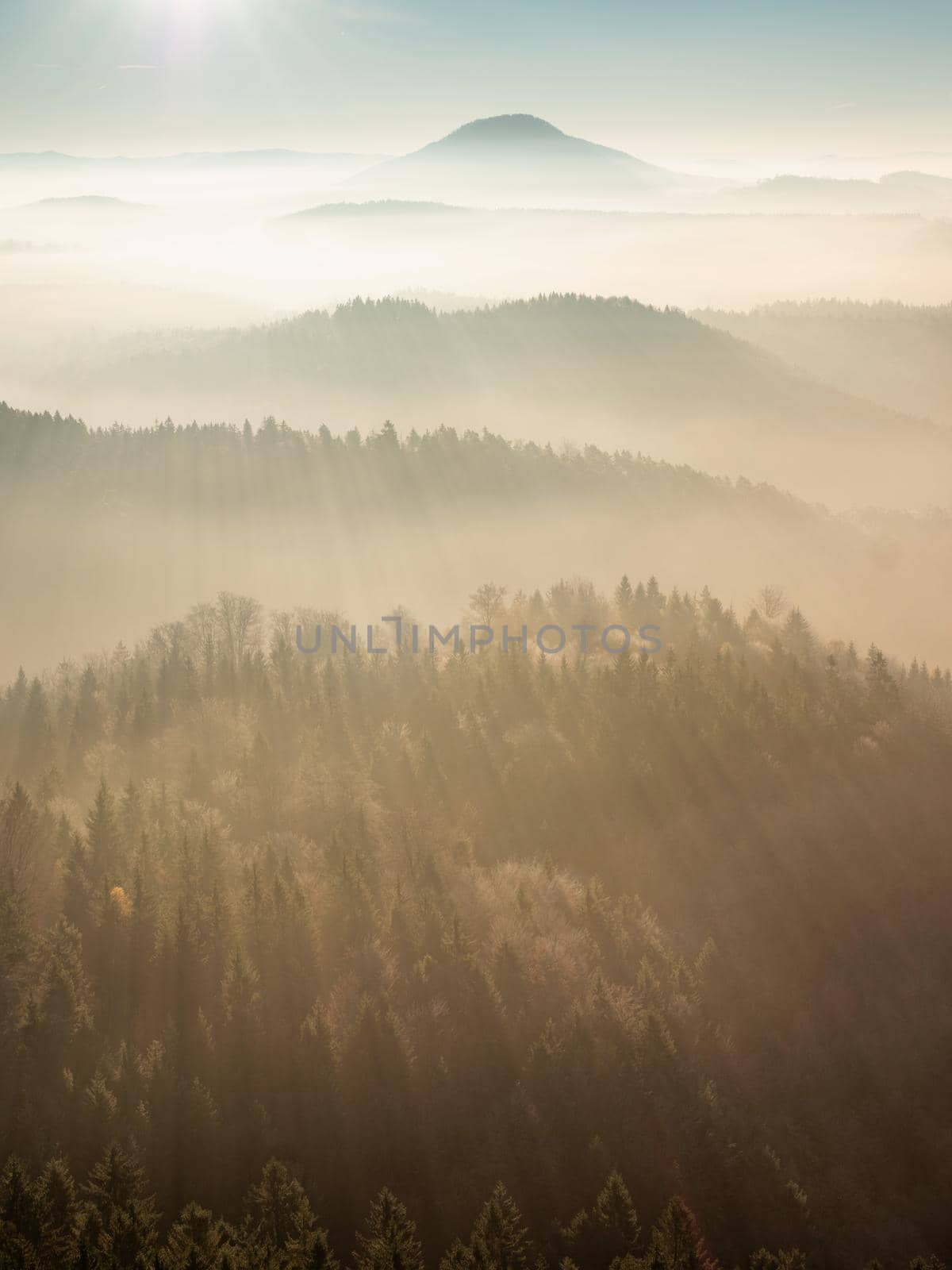 Beautiful misty sunset in hilly landscape. Nature travel and adventure by rdonar2