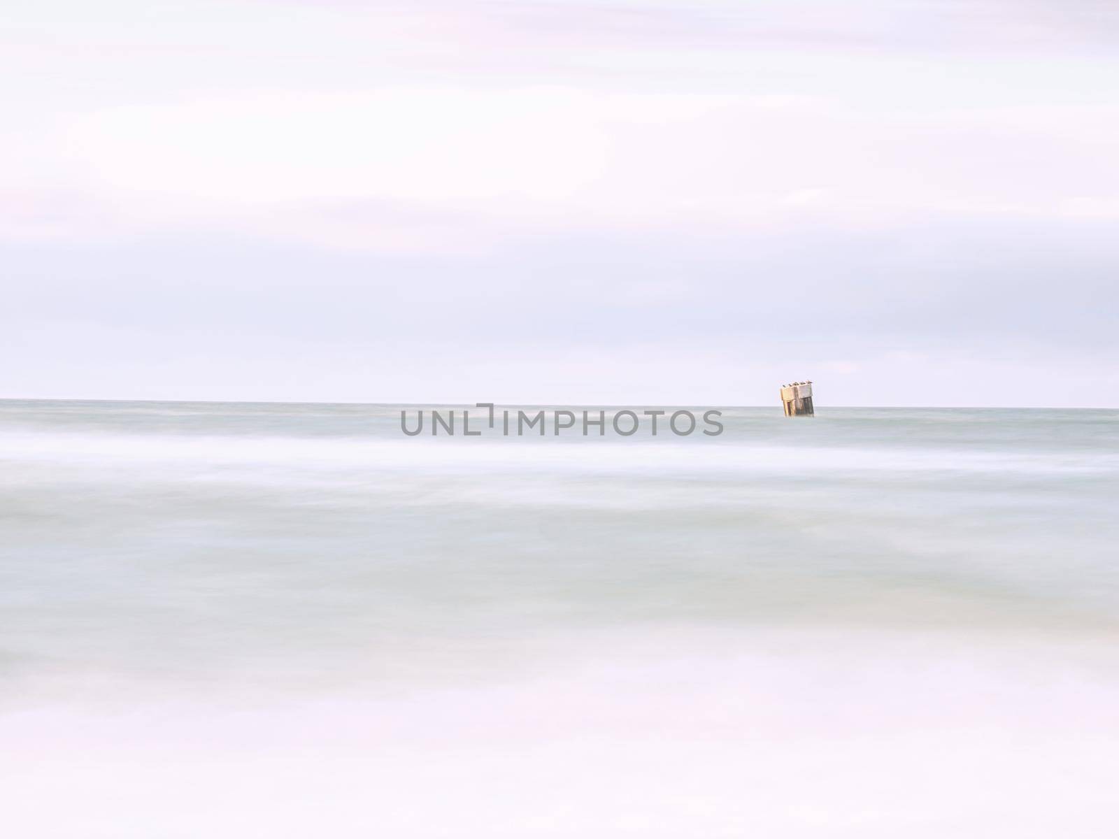 Summer sunset on the Gulf, long exposure of calm ocean