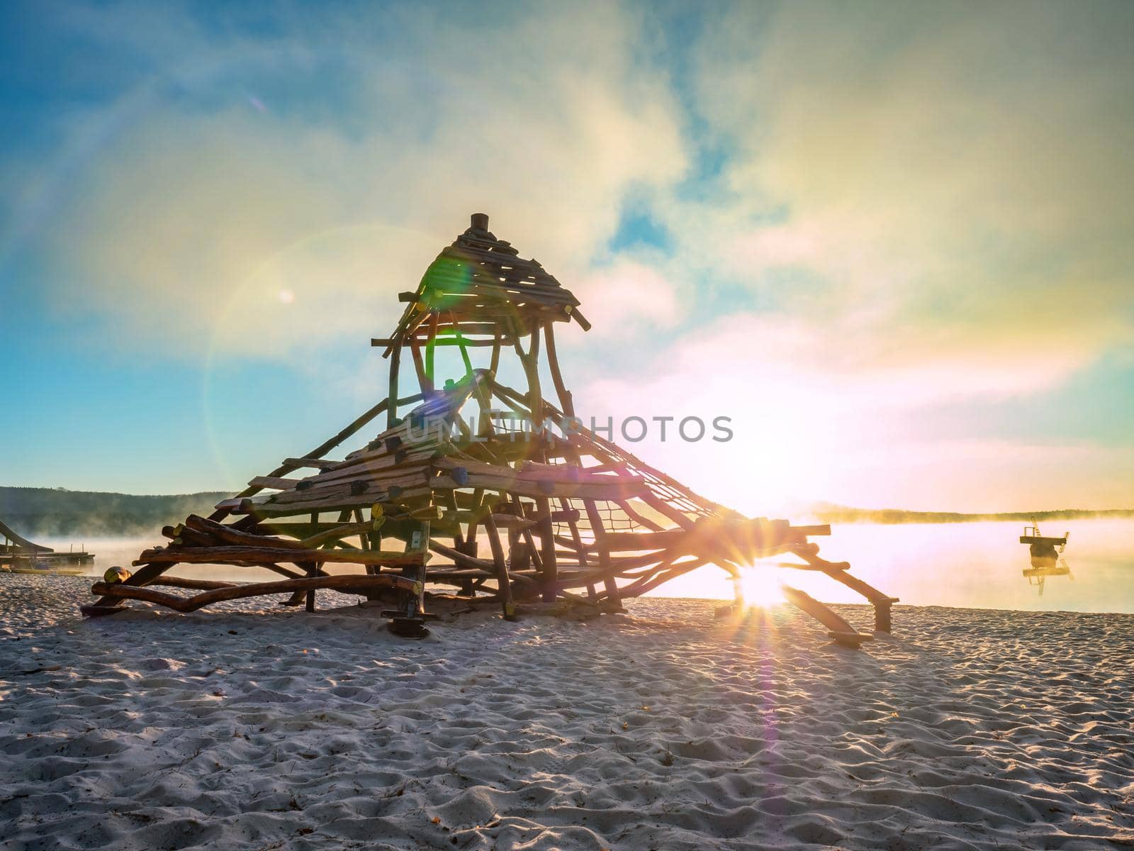 Wooden construction, recreation on the beach on sunny day. Childhood, equipment and object concept