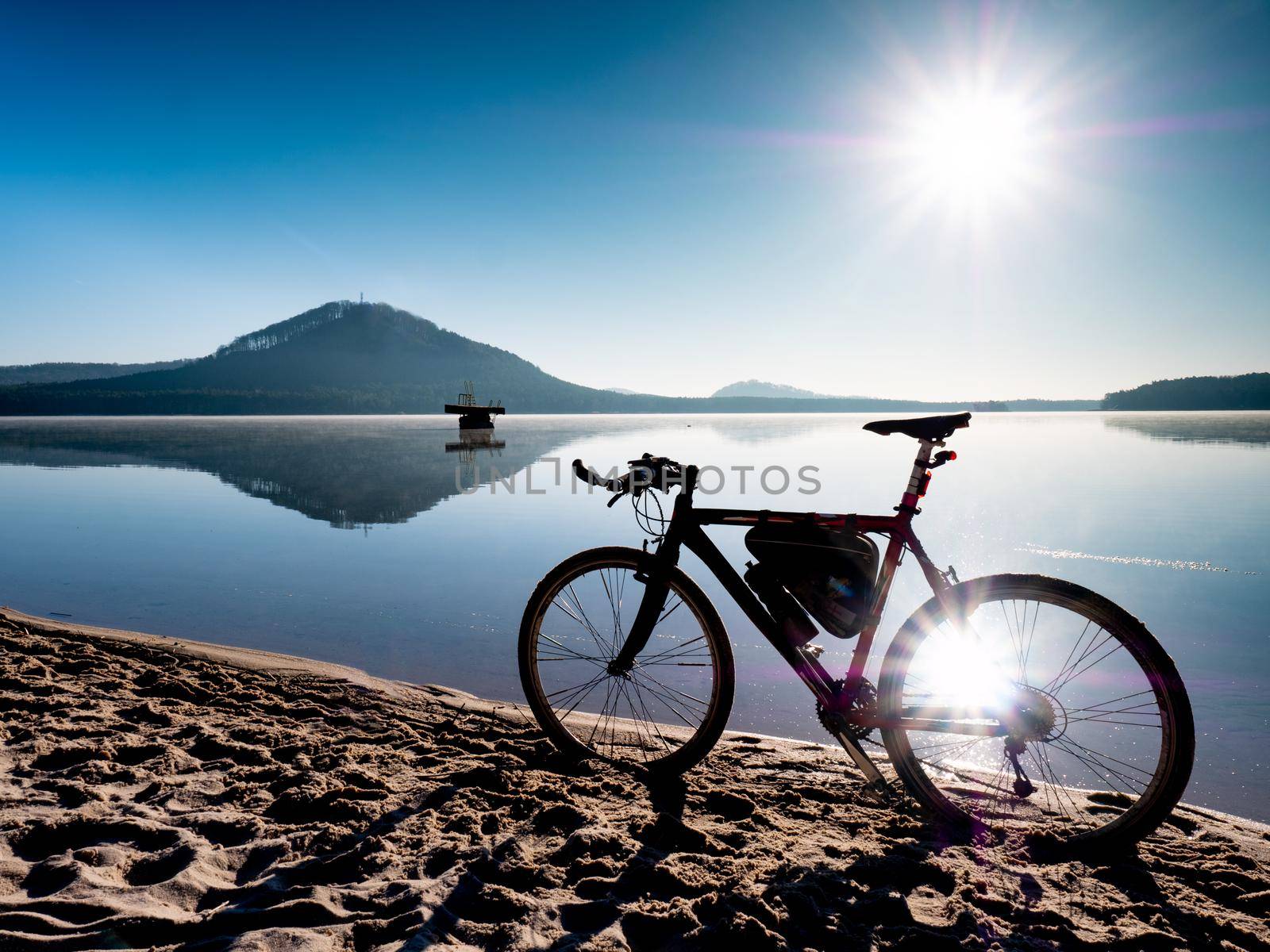 Trekking bike or gravel bike at lake on morning nature landscape by rdonar2