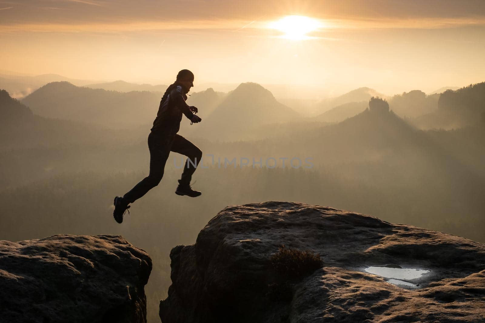 Man jumping against sky during sunset. Pure excitment  by rdonar2