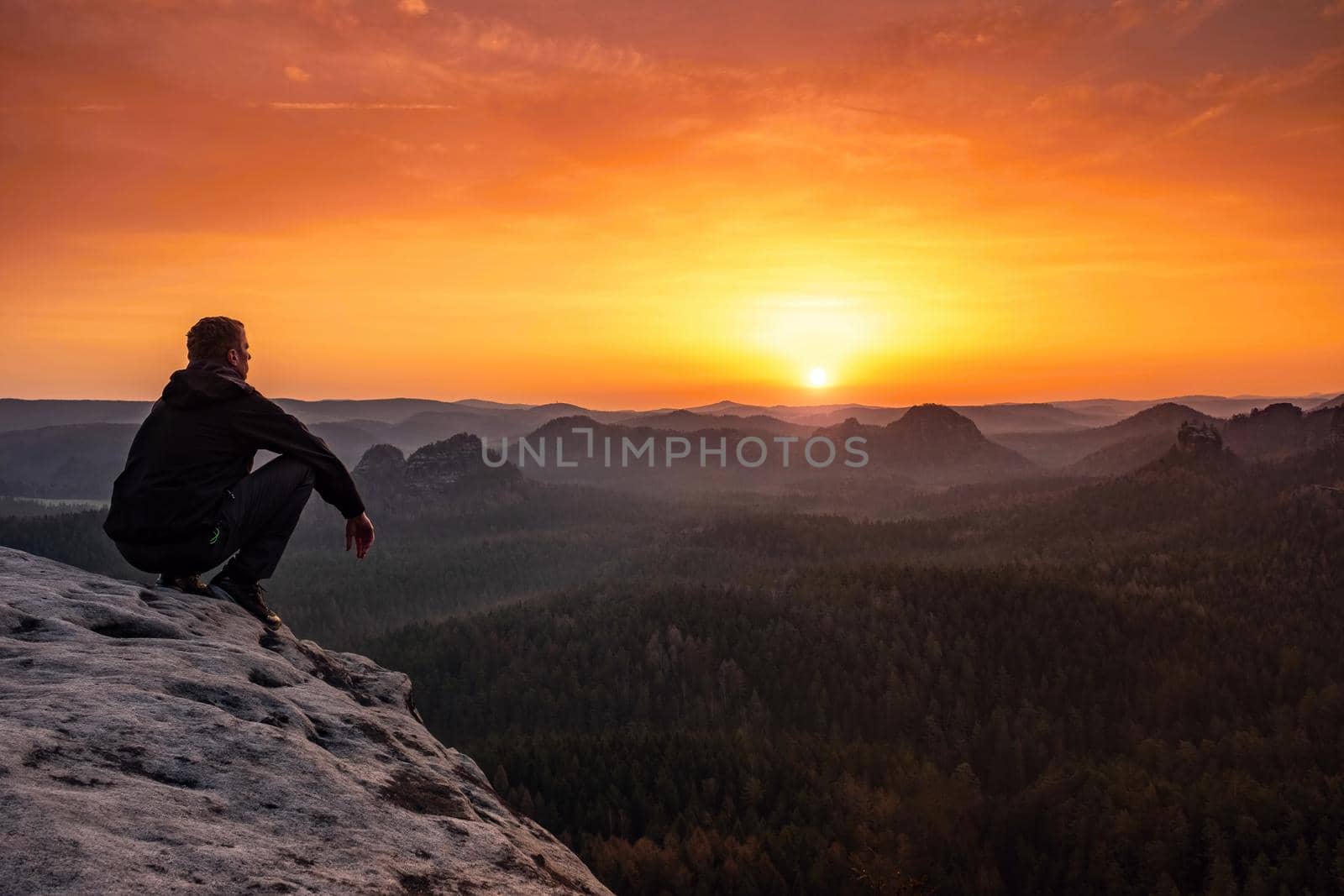 Mature man sit  on top of mountain by rdonar2