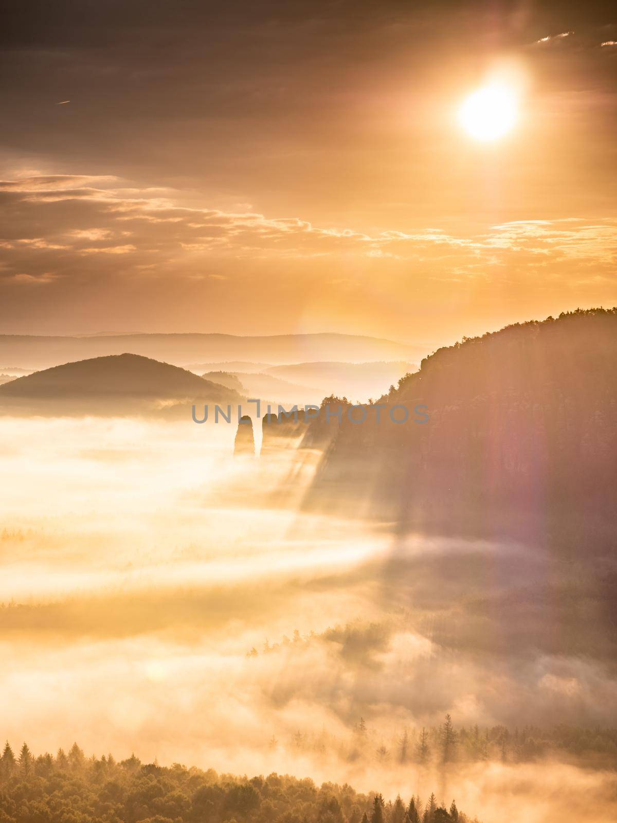 Bright fog and orange dawn over the valley bordered by the Blossstock massif by rdonar2