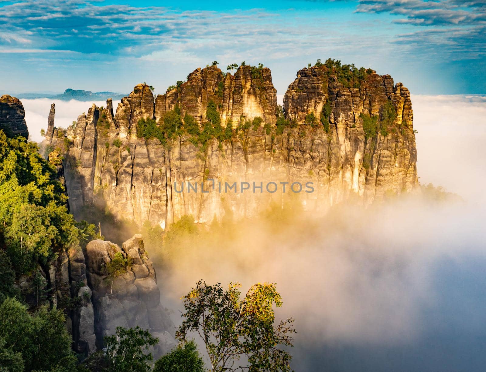 The Schrammsteine rock formations stand in an area known as Saxon Switzerland park by rdonar2