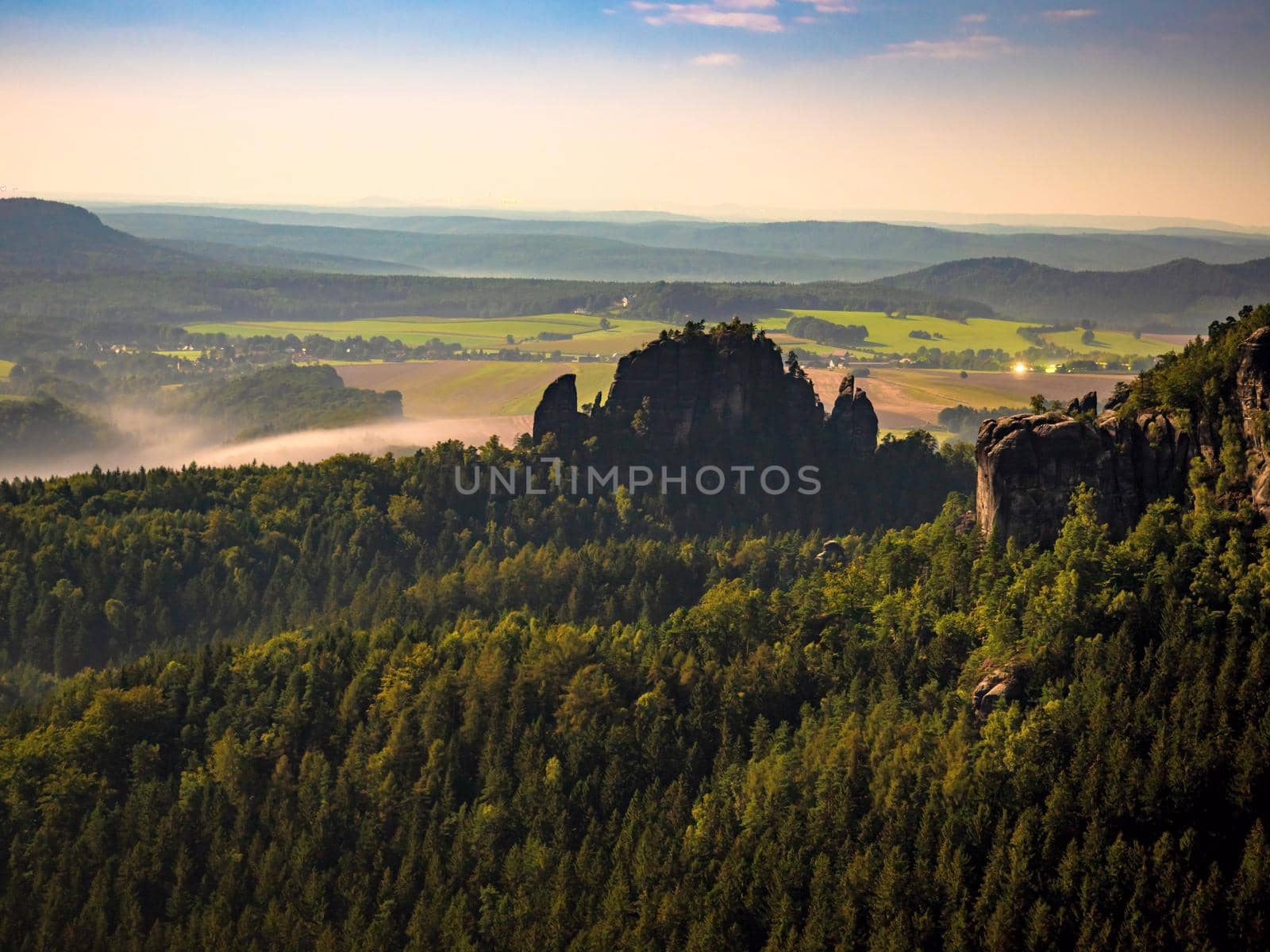 The Rauschenstein rock formations in Moon light. Rocks above Elbe River in an area known as Saxon Switzerland park near Bad Schandau, Germany. The park located in Saxony near the border to the Czech Republic, is a popular tourist destination and is known for its dramatic rock formations, hiking and rock climbing.