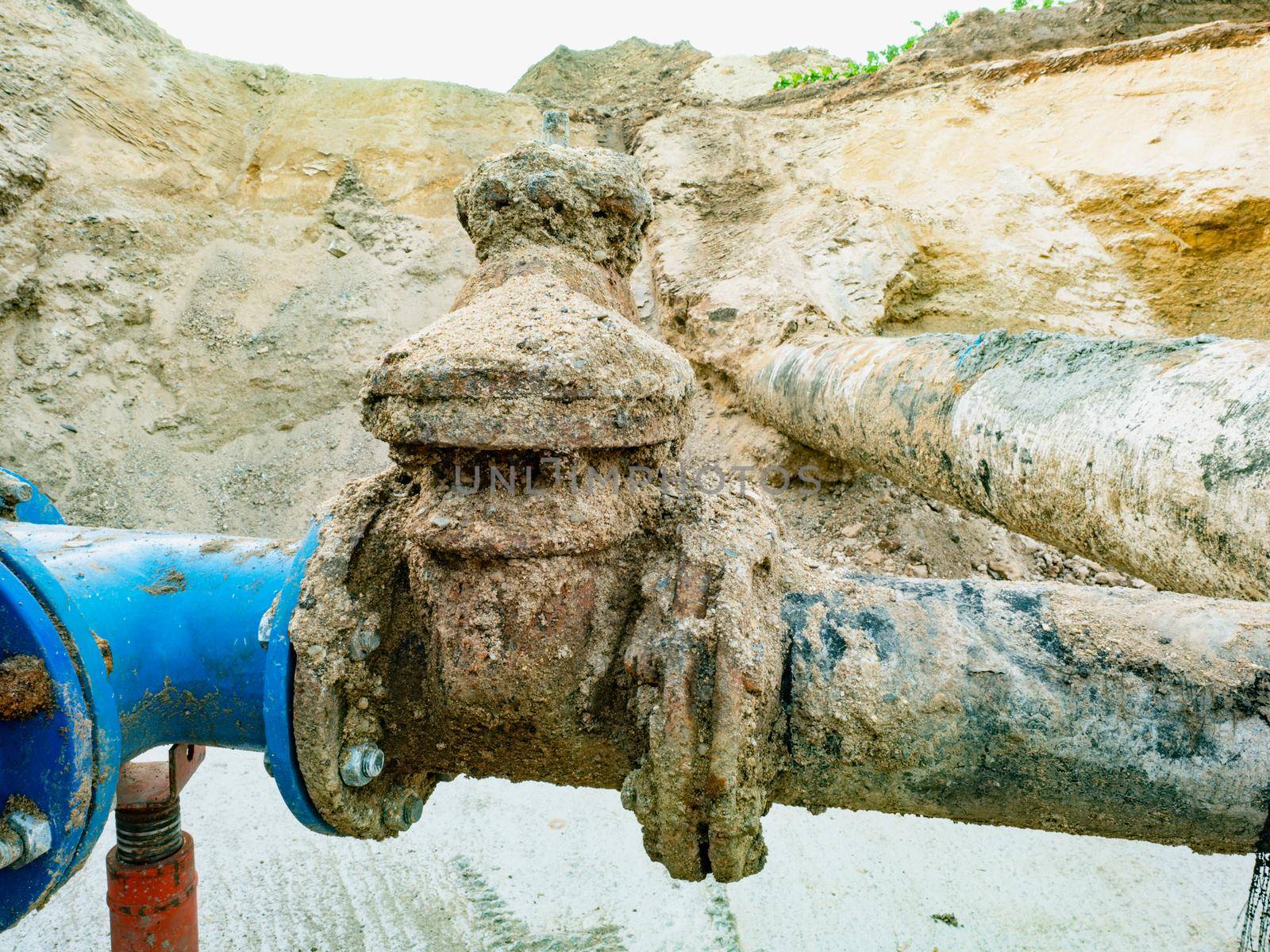 Pipes and a pipe for waterworks in digging in the road construct. Rewal potable water network