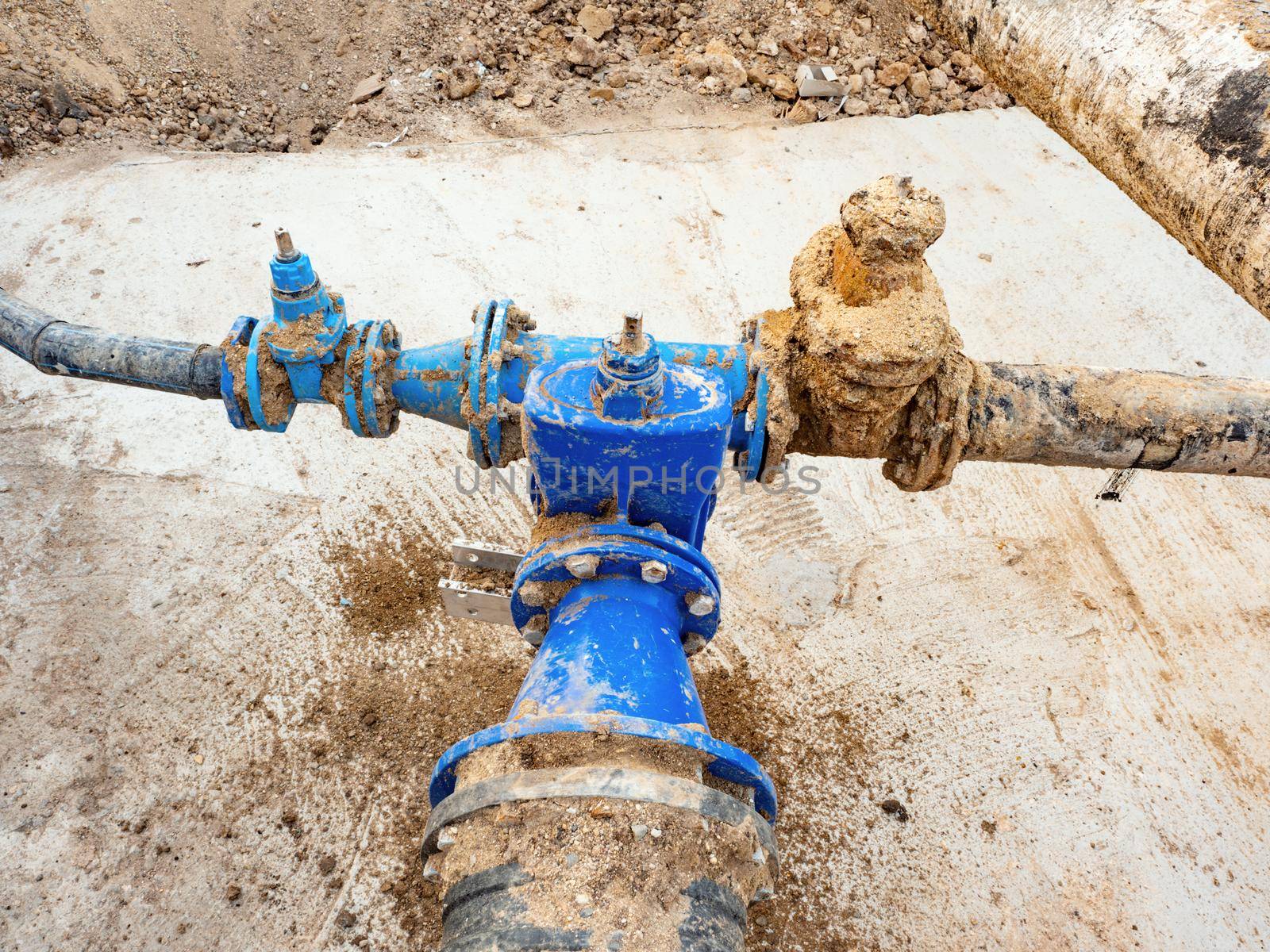 Pipes and a pipe for waterworks in digging in the road construct. Rewal potable water network