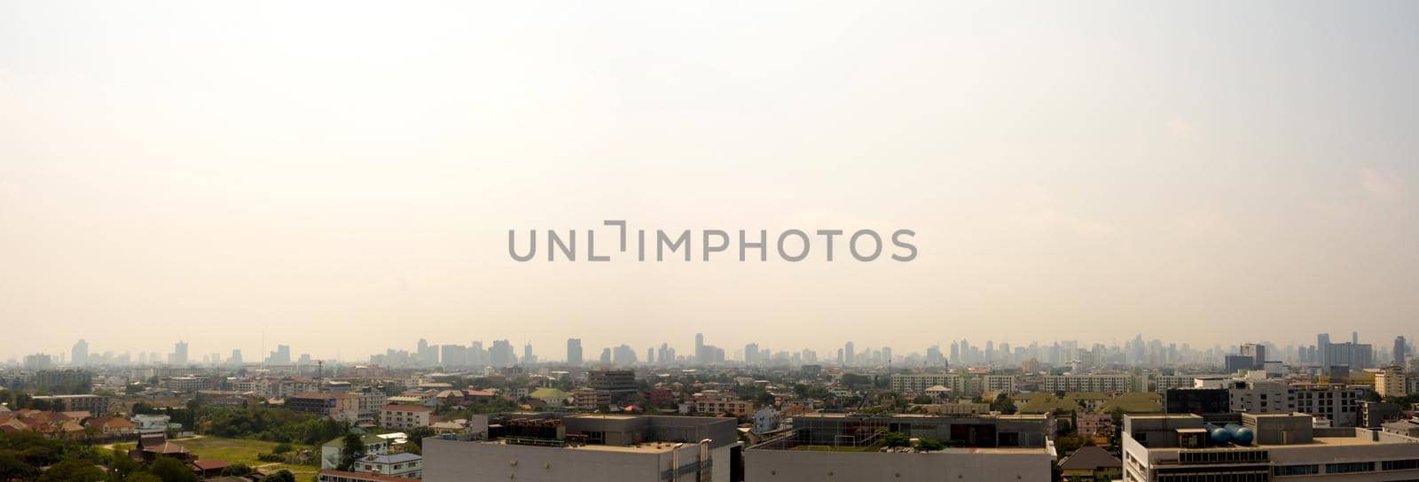 Cityscape urban skyline in the mist or smog. Wide and High view image of Bangkok city in the smog by Satakorn