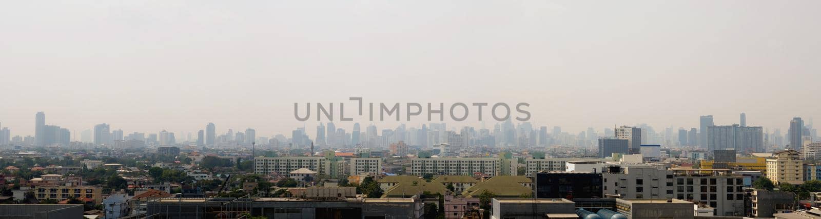 Bangkok City downtown cityscape urban skyline in the mist or smog. Wide and High view image of Bangkok city in the 
smog