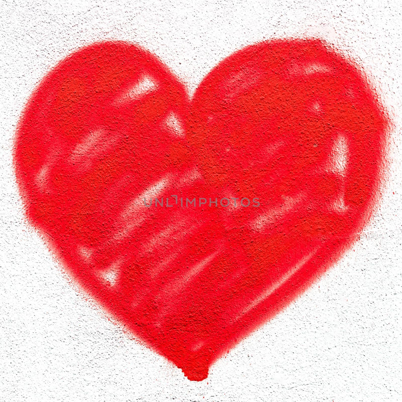 Red heart on wall by germanopoli