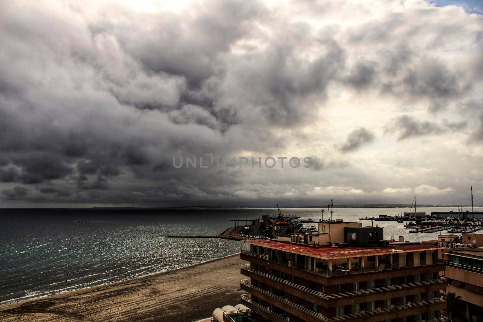 Beach under stormy sky in Santa Pola, Alicante, Spain