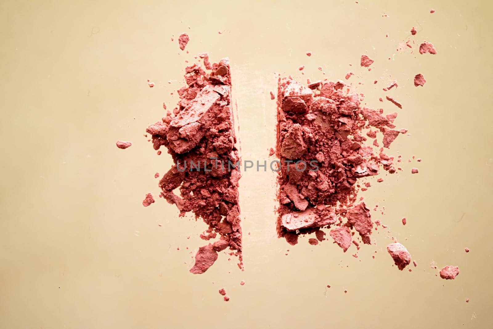 Crushed cosmetics, mineral organic eyeshadow, blush and cosmetic powder isolated on golden background, makeup and beauty banner, flatlay design.