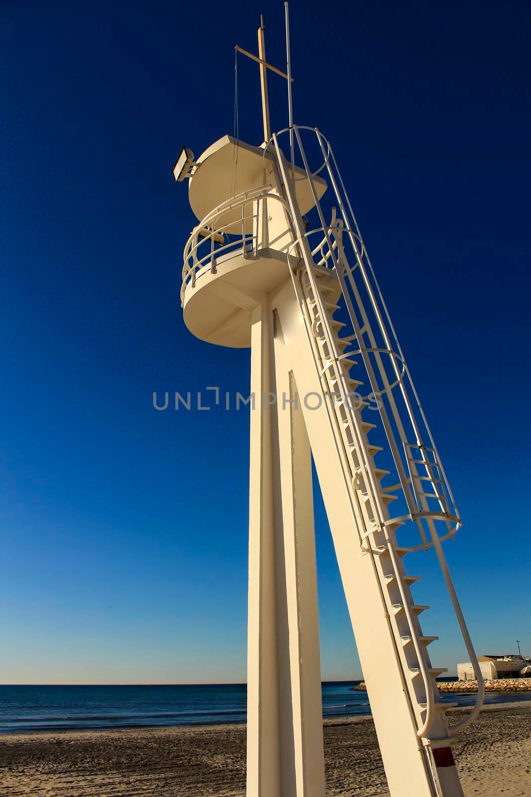 Lifeguard tower on a quiet and lonely beach in a sunny day in southern Spain, Alicante.
