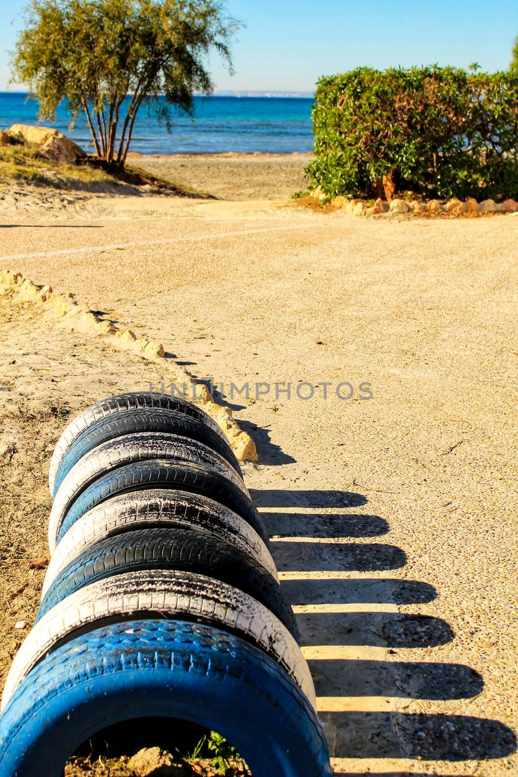 Ecological bicycle parking made with tires on the beach in Santa Pola, Spain