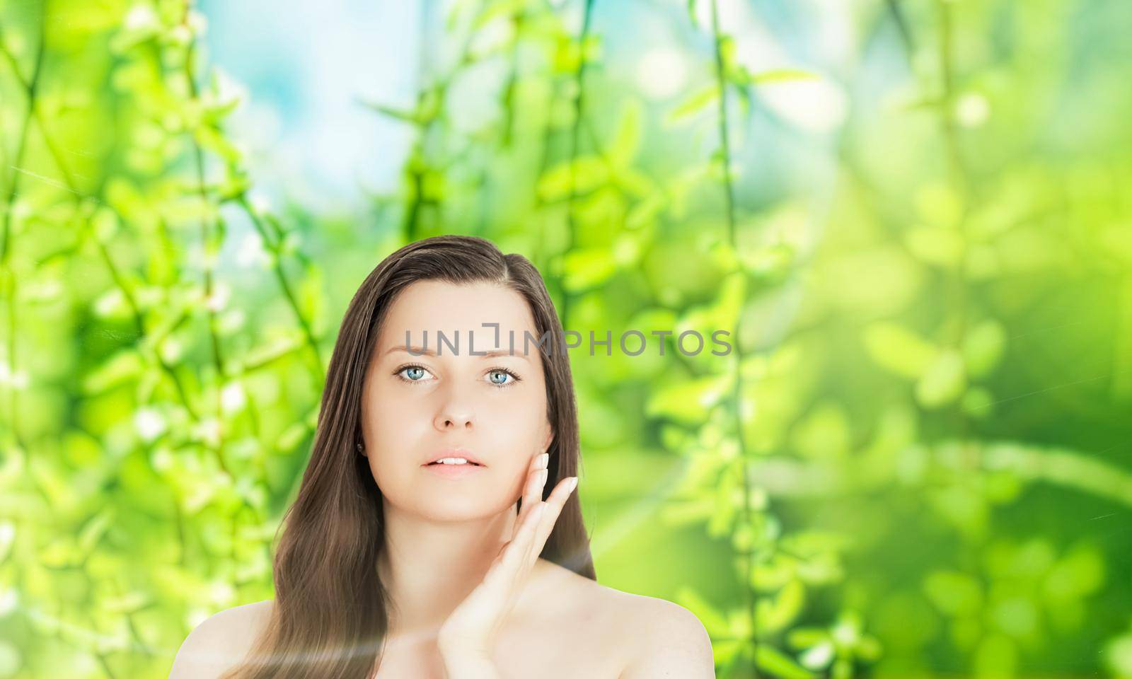 Beauty portrait of young woman for natural skincare and cosmetic brand, spring nature on background as wellness, health and organic beauty concept.