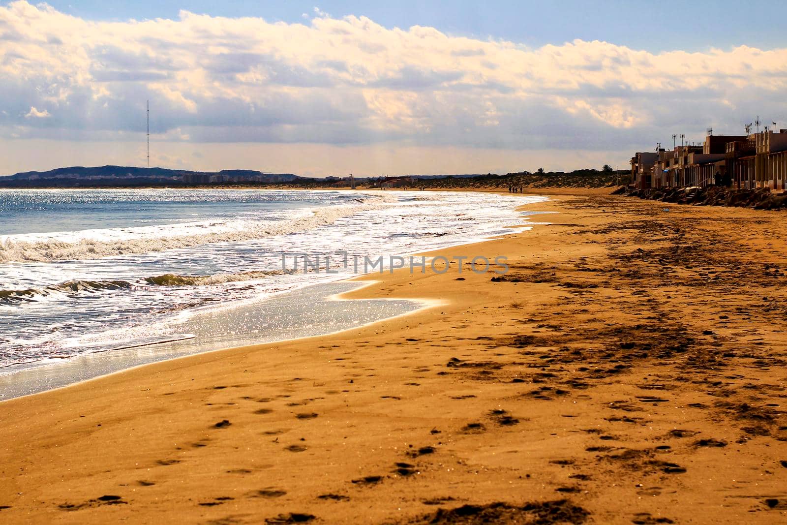 Sunny day on the beach in winter in La Marina, Alicante