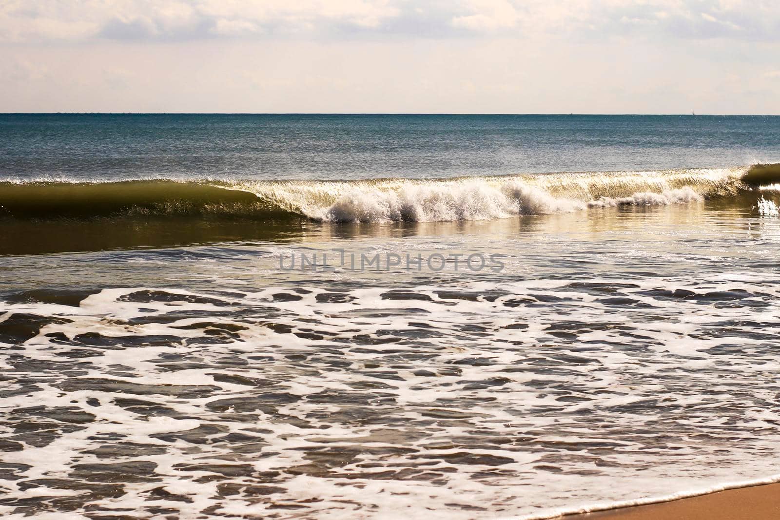 Sunny day on the beach in winter in La Marina, Alicante