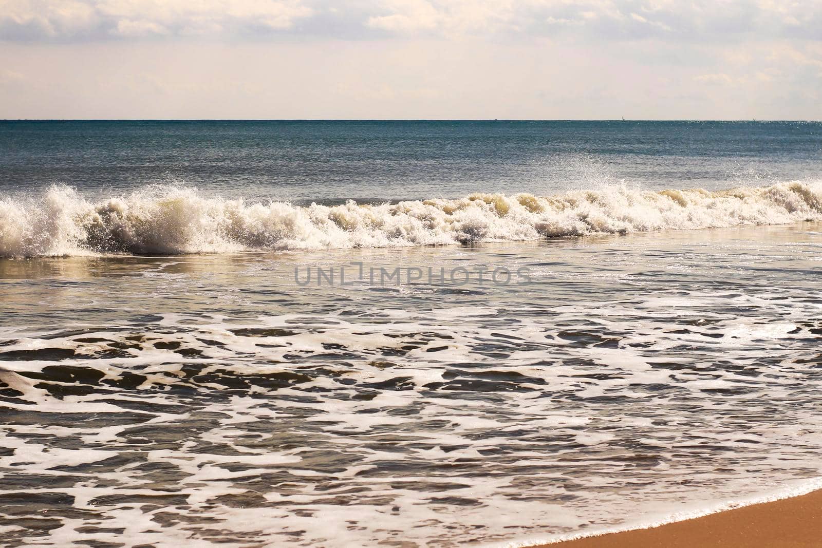 Sunny day on the beach in winter in La Marina, Alicante
